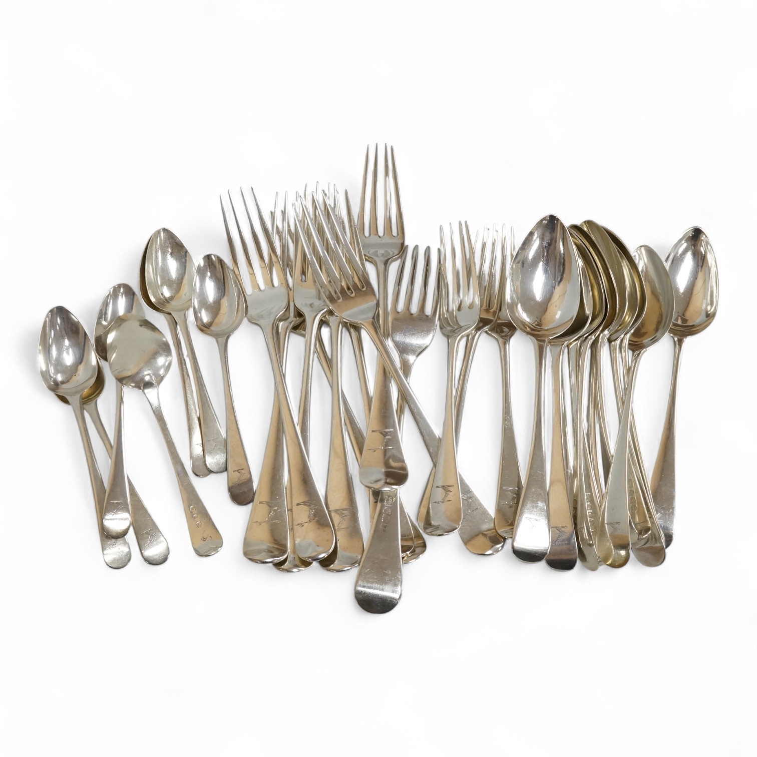 A harlequin part canteen of 19th century Old English pattern flatware, comprising thirty items, all with engraved crest, various dates and makers, 38.1oz.